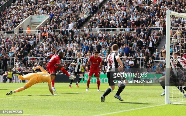 Naby Keita of Liverpool scores their team's first goal during the Premier League match between Newcastle United and Liverpool at St. James Park on...