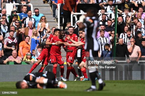 Naby Keita celebrates with teammates Luis Diaz, Diogo Jota and Andrew Robertson of Liverpool after scoring their team's first goal during the Premier...