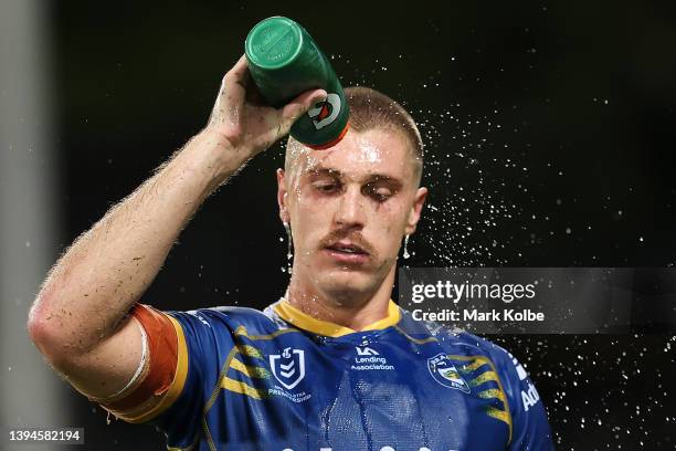 Shaun Lane of the Eels sprays water on himself during the round eight NRL match between the Parramatta Eels and the North Queensland Cowboys at TIO...