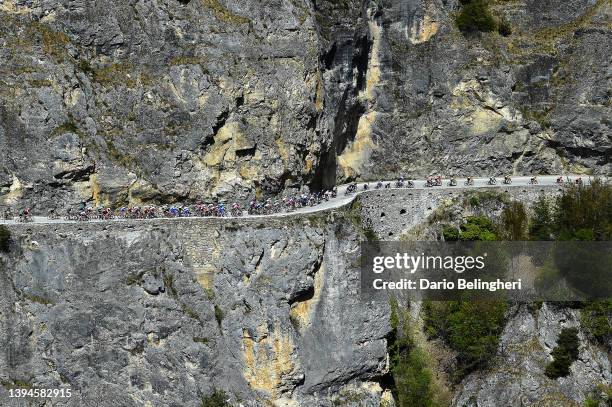 General view of the peloton passing through a rocky landscape at Les Pontis - San-Luc during the 75th Tour De Romandie 2022 - Stage 4 a 180,1km stage...