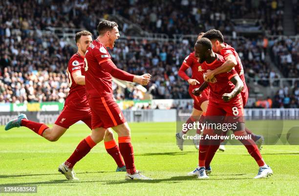 Naby Keita of Liverpool celebrates after scoring the first goal during the Premier League match between Newcastle United and Liverpool at St. James...