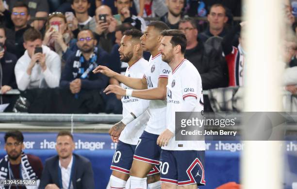 Kylian Mbappe of PSG celebrates his first goal between Neymar Jr and Lionel Messi during the Ligue 1 Uber Eats match between RC Strasbourg Alsace and...