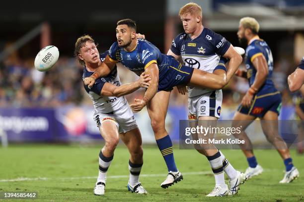 Ryan Matterson of the Eels passes as he is tackled during the round eight NRL match between the Parramatta Eels and the North Queensland Cowboys at...