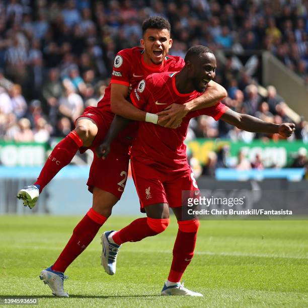 Naby Keita of Liverpool celebrates scoring the opening goal with team-mate Luis Diaz during the Premier League match between Newcastle United and...