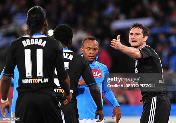 Chelsea's midfielder Frank Lampard gestures with Chelsea's Ivorian forward Didier Drogba during the Champions League round of 16 first leg football...