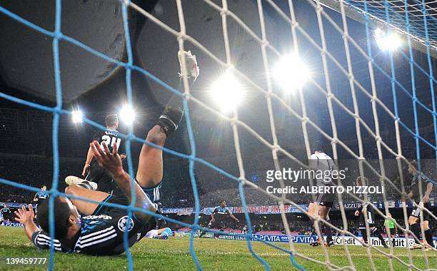 Chelsea's defender Ashley Cole falls in the net during the Champions League round of 16 first leg football match, Napoli vs Chelsea at San Paolo...