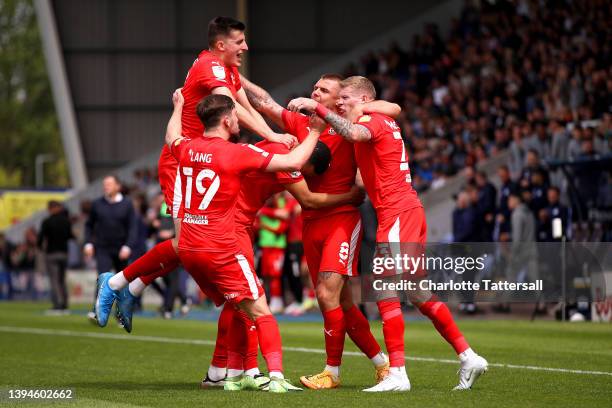 Callum Lang, Kelland Watts, Jordan Cousins, Max Power and James McClean of Wigan Athletic celebrate their sides first goal after an own goal by Josh...