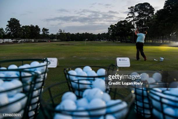Tim Herron of the United States plays a shot on the driving range before the second round of the Insperity Invitational at The Woodlands Golf Club on...