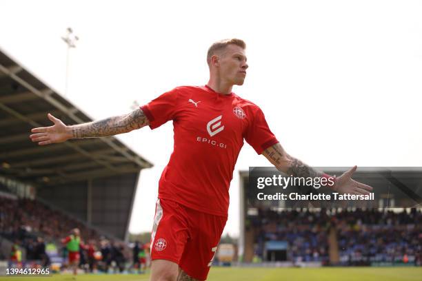 James McClean celebrates their sides third goal scored by Will Keane of Wigan Athletic during the Sky Bet League One match between Shrewsbury Town...