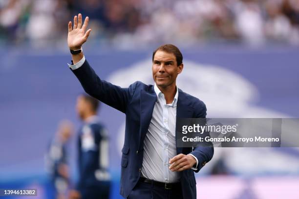 Tennis player Rafael Nadal acknowledges the fans after taking the honorary kick-off prior to the LaLiga Santander match between Real Madrid CF and...