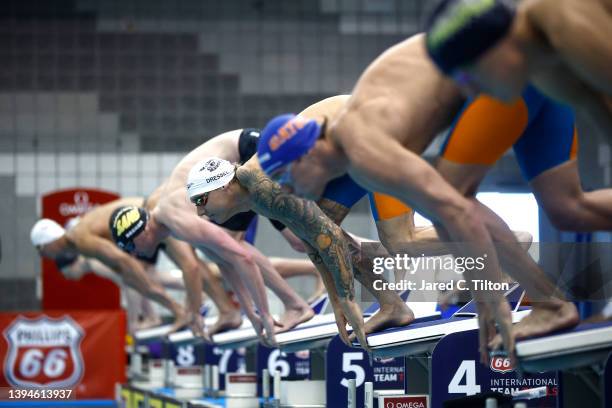 Caeleb Dressel prepares to leap from the starting block to compete in the Men's 50m Freestyle Heat on Day Five of the Phillips 66 International Team...