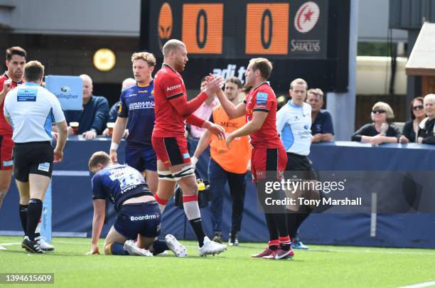 Max Malins of Saracens celebrates scoring their first try during the Gallagher Premiership Rugby match between Worcester Warriors and Saracens at...