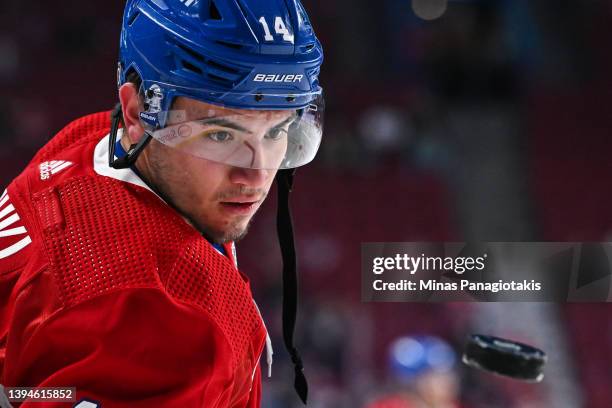 Nick Suzuki of the Montreal Canadiens watches the puck during warmups prior to the game against the Florida Panthers at Centre Bell on April 29, 2022...