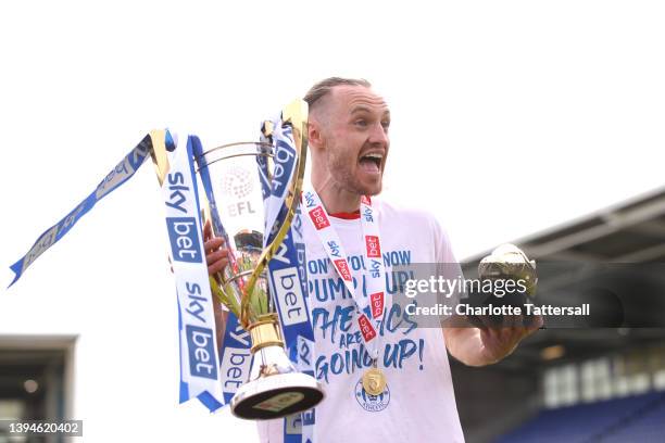 Will Keane of Wigan Athletic celebrates with the League One Trophy and the Golden Boot award after their sides victory and promotion to the...