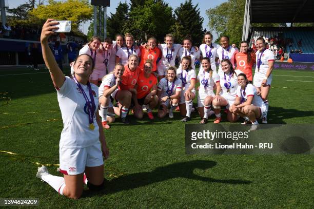 Jess Breach of England takes a selfie with teammates as they celebrate winning the grand slam following their victory in the TikTok Women's Six...