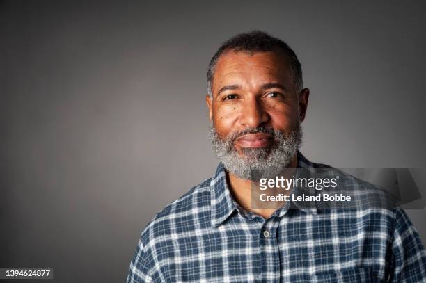 studio portrait of middle aged african american male - homem 55 anos imagens e fotografias de stock