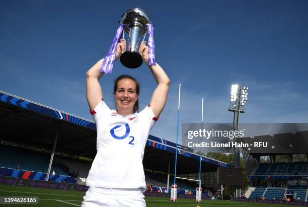 Emily Scarratt of England poses with the trophy after winning the grand slam following their victory in the TikTok Women's Six Nations match between...