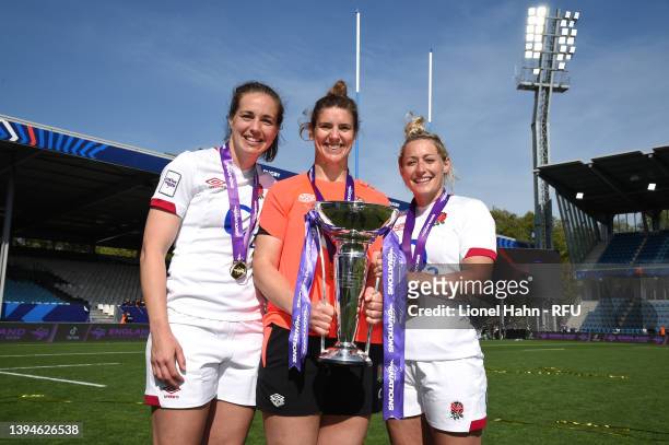 Emily Scarratt, Sarah Hunter and Natasha Hunt of England pose with the trophy after winning the grand slam following their victory in the TikTok...