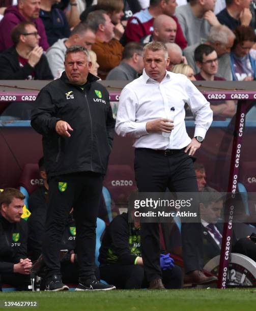 Dean Smith, Manager of Norwich City and Craig Shakespeare, Assistant Head Coach of Norwich City react during the Premier League match between Aston...