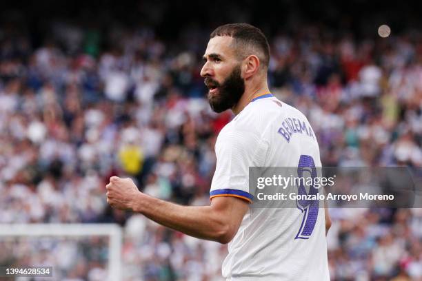 Karim Benzema of Real Madrid celebrates after scoring their team's fourth goal during the LaLiga Santander match between Real Madrid CF and RCD...