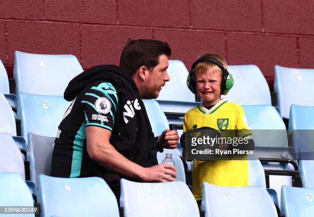 Norwich City fan looks dejected following their side's defeat in the Premier League match between Aston Villa and Norwich City at Villa Park on April...