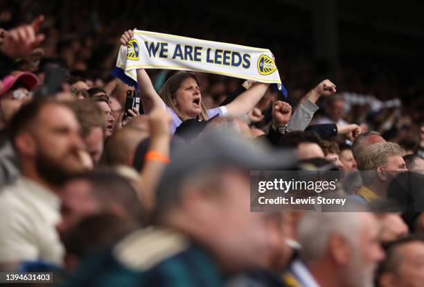Leeds United fan shows their support with a scarf prior to the Premier League match between Leeds United and Manchester City at Elland Road on April...
