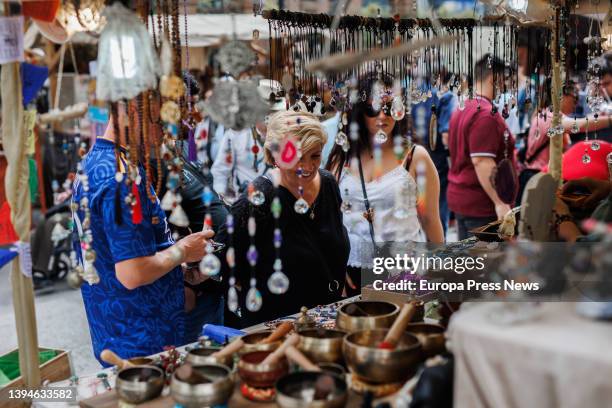 Several people look at items in a stall at the Medieval Fair of El Alamo, on 30 April, 2022 in El Alamo, Madrid, Spain. This town celebrates its XXV...