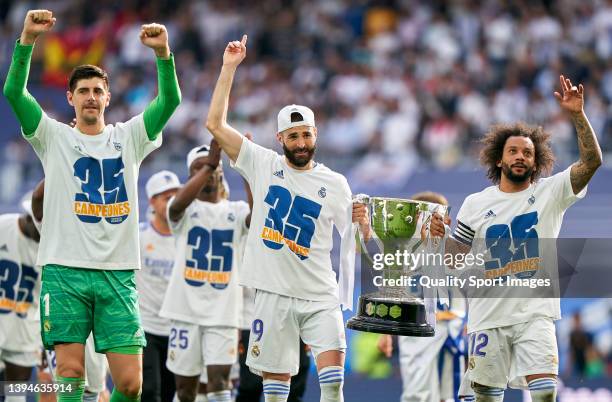 Marcelo Vieira and Karim Benzema of Real Madrid CF hold the trophy of La Liga after the La Liga Santander match between Real Madrid CF and RCD...