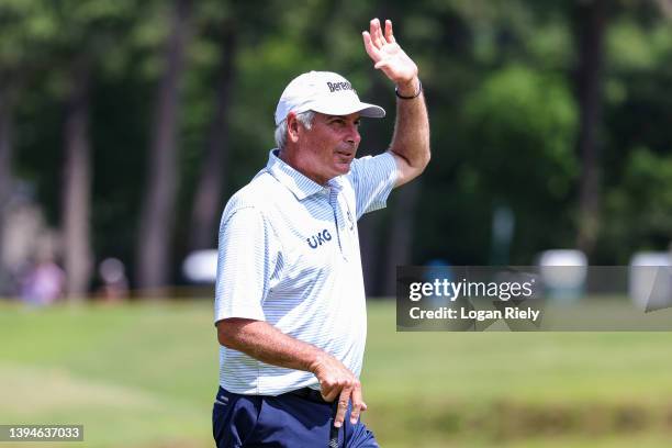 Fred Couples of the United States smiles after making a putt on the third hole during the second round of the Insperity Invitational at The Woodlands...