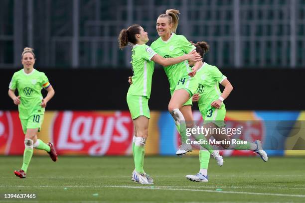 Jill Roord of VfL Wolfsburg celebrates with team mate Dominique Janssen after scoring their sides second goal during the UEFA Women's Champions...