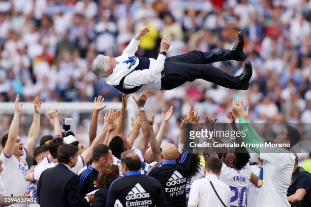Carlo Ancelotti, Head Coach of Real Madrid is hoisted by his players following their victory in the LaLiga Santander match between Real Madrid CF and...