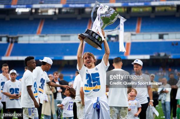 Luka Modric of Real Madrid CF holds the LaLiga trophy aloft as they celebrate winning La Liga Santander title after the LaLiga Santander match...