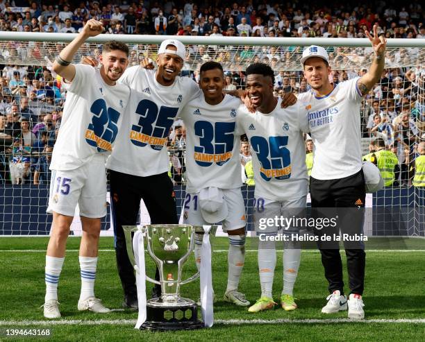 Real Madrid players pose with the LaLiga trophy as they celebrate winning La Liga Santander title after the LaLiga Santander match between Real...