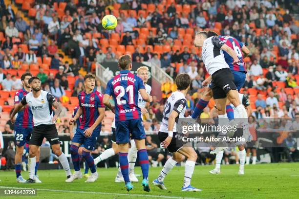 Oscar Duarte of Levante scores their team's first goal during the LaLiga Santander match between Valencia CF and Levante UD at Estadio Mestalla on...