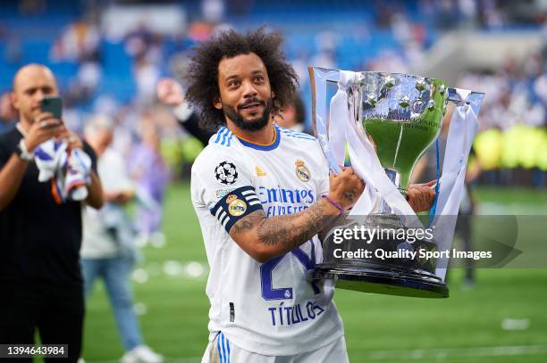 Marcelo Vieira of Real Madrid CF holds the LaLiga trophy as they celebrate winning La Liga Santander title after the LaLiga Santander match between...