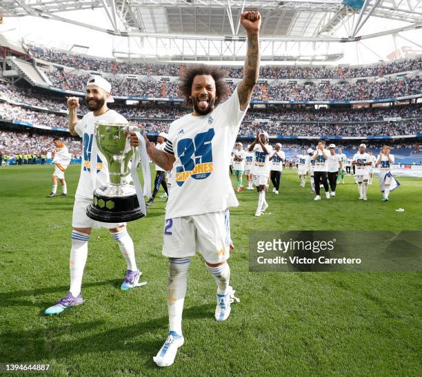 Marcelo Vieira and Karim Benzema of Real Madrid hold the LaLiga trophy as they celebrate winning the La Liga Santander title after the LaLiga...