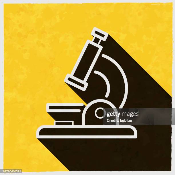 microscope. icon with long shadow on textured yellow background - microscope lens stock illustrations