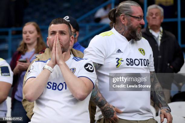 Leeds fans look dejected after the Premier League match between Leeds United and Manchester City at Elland Road on April 30, 2022 in Leeds, England.