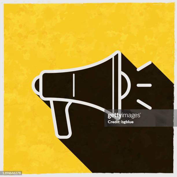 megaphone. icon with long shadow on textured yellow background - white amplifier stock illustrations