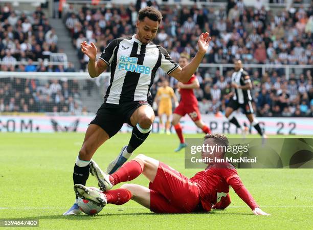 Andrew Roberston of Liverpool tackles Jacob Murphy of Newcastle United during the Premier League match between Newcastle United and Liverpool at St....