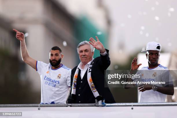 Karim Benzema, Carlo Ancelotti, Head Coach of Real Madrid and Vinicius Junior celebrate at Plaza de Cibeles following their victory in their LaLiga...