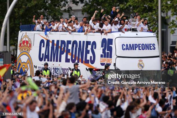 Players of Real Madrid are seen on a bus at Plaza de Cibeles following their victory in their LaLiga match against RCD Espanyol which lead to their...