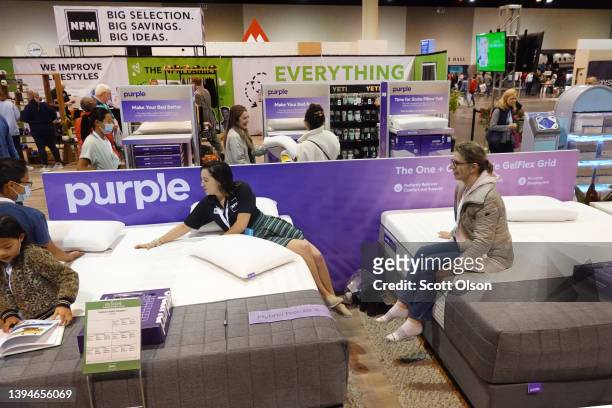 Shareholders shop for items at the Nebraska Furniture Mart display at the Berkshire Hathaway annual shareholder's meeting on April 30, 2022 in Omaha,...