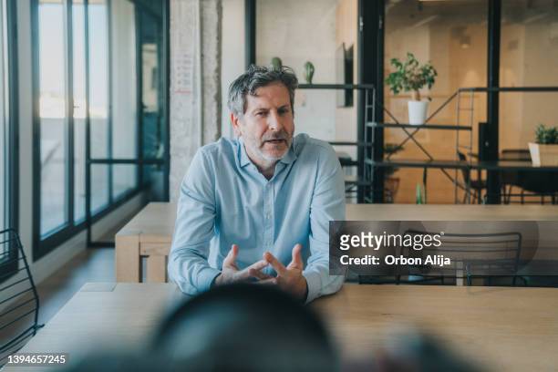 man talking to camera - man talking to camera stock pictures, royalty-free photos & images