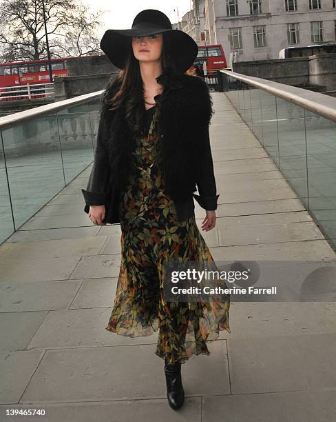 Peony Lim, Blogger, wearing russet and moss green autumunal leaf print vintage chiffon dress, black Zara jacket, Joseph hat and Fendi bag at London...