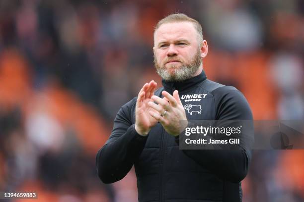 Wayne Rooney, manager of Derby County, applauds the visiting support after the Sky Bet Championship match between Blackpool and Derby County at...