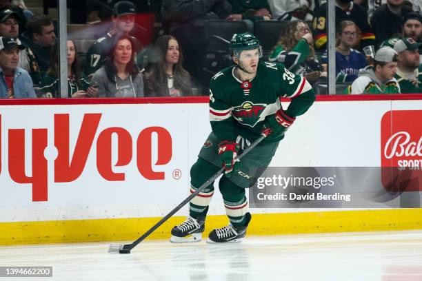 Ryan Hartman of the Minnesota Wild skates with the puck against the Vancouver Canucks in the first period of the game at Xcel Energy Center on March...