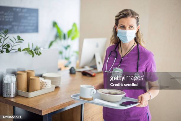 nurse using digital banking - hospital food stock pictures, royalty-free photos & images