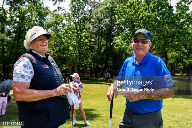 Laura Davies of the United Kingdom laughs with Dave Stockton of the United States on the 10th hole during the Greats of Golf competition at the...