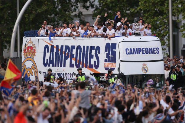 Players of Real Madrid are seen on a bus at Plaza de Cibeles following their victory in their LaLiga match against RCD Espanyol which lead to their...